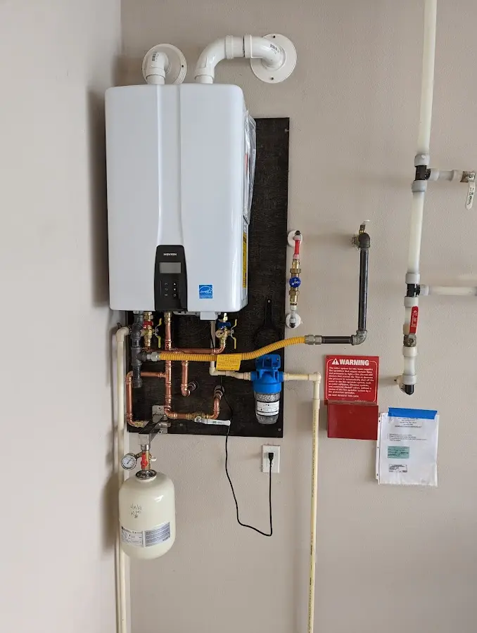 Professional plumber installing copper piping in a Steiner Ranch home